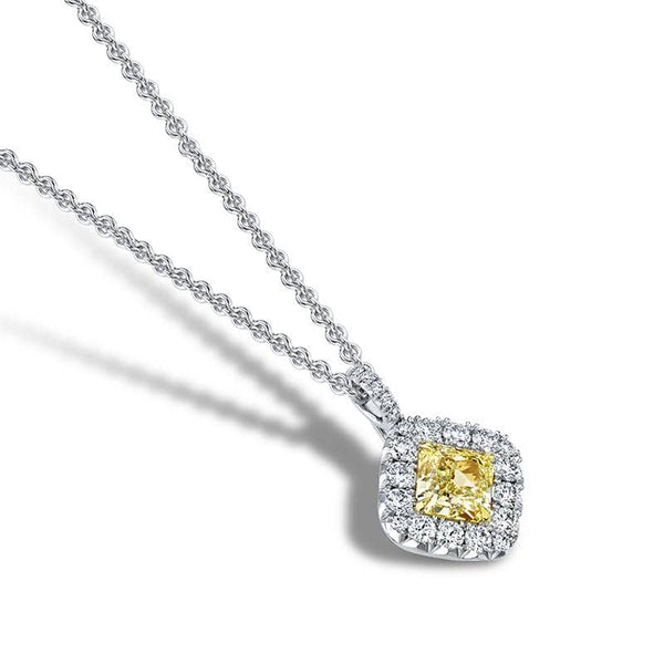 Custom made necklace featuring a 1.03 carat radiant fancy yellow diamond center stone with .43 carats total weight in round brilliant cut diamonds set in platinum & 18k yellow gold and an adjustable 16