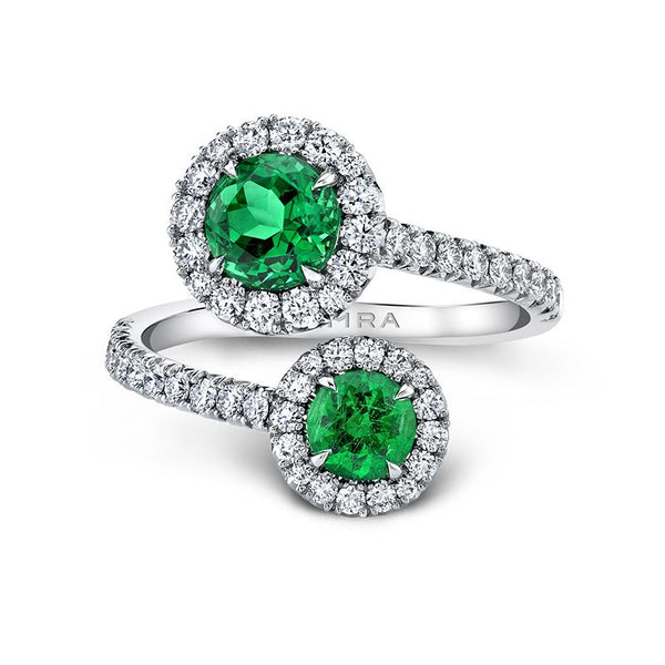 Custom made bypass ring featuring 1.48 carats total weight in round emeralds and .73 carats total in round brilliant cut diamond set in platinum.