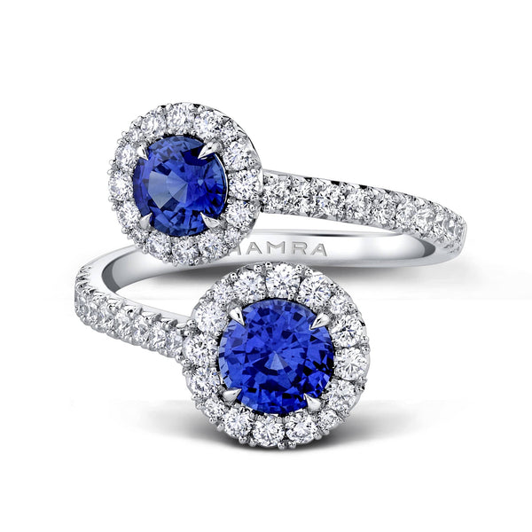 Custom made Embrace ring featuring 1.97 carats total weight in round blue sapphires with .71 carats total weight in round brilliant cut accent diamonds set in platinum.
