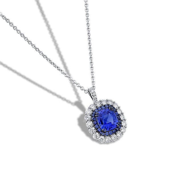 Hand fabricated necklace featuring a 2.51 carat cushion cut sapphire with 1.03 carats total weight in round brilliant cut diamond accents and .30 carats total in round accent sapphires set in platinum with an adjustable 16-18