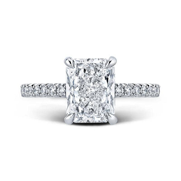 Handcrafted ring featuring a 2.60 carat radiant cut center diamond with .47 carats total weight in round brilliant cut accent diamonds set in platinum.