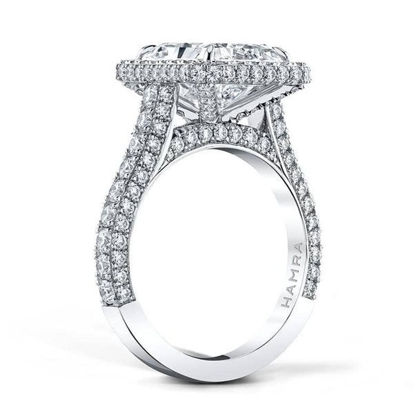 Custom fabricated ring featuring a 5.01 carat radiant cut center diamond with 1.93 carats of round brilliant cut accent diamonds set in platinum.