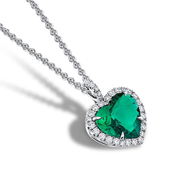 Custom made necklace featuring a 2.07 carat heart shaped emerald with .28 carats total weight in round brilliant cut diamonds set in platinum.