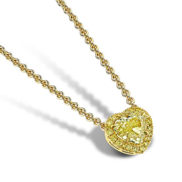 Custom made necklace featuring a 2.33 carat fancy yellow heart shaped diamond center with .23 carats total weight in round brilliant cut fancy yellow diamonds set in 18k yellow gold.