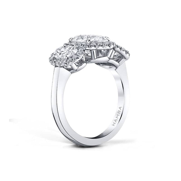 Hand-fabricated ring featuring a 1.50 carat oval center diamond with 1.03 carats total weight in oval shaped side diamonds and .34 carats total in round brilliant cut accent diamonds set in platinum.