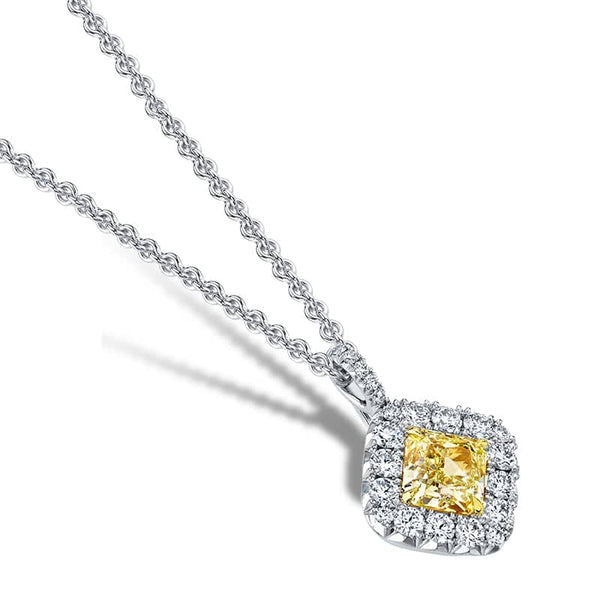 Custom made necklace featuring a 2.00 carat radiant cut fancy yellow diamond center with .60 carats total weight in round brilliant cut diamonds set in platinum and 18k yellow gold.