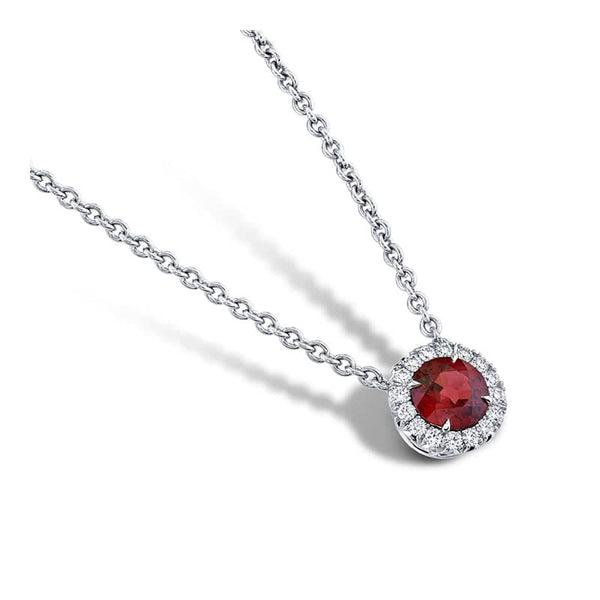 Custom made necklace featuring a .75 carat round ruby with .20 carats total weight in round brilliant cut accent diamonds set in platinum.  Includes a platinum 16-18