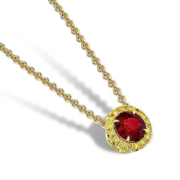 Custom made necklace featuring a 1.23 carat round ruby center with .23 carats total weight in fancy yellow round brilliant cut diamonds set in 18k yellow gold.