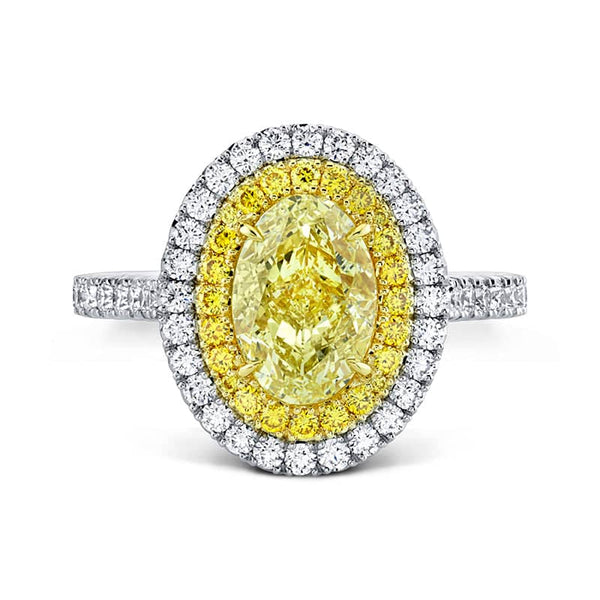 Custom made ring featuring a 2.02 carat fancy yellow oval shaped diamond center with .66 carats total weight in round brilliant cut white diamonds and .21 carats total in fancy yellow round diamonds set in platinum and 18k yellow gold.