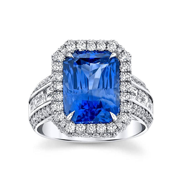 Custom made ring featuring a 7.68 carat radiant cut medium light blue sapphire with 1.03 carats total weight in fancy cut baguette diamonds and 1.45 carats total in round brilliant cut diamonds set in platinum.