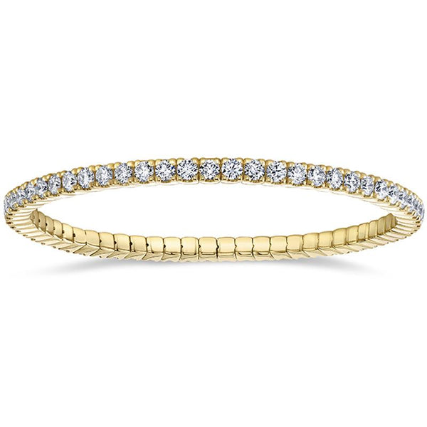 Hand crafted eternity bracelet featuring 5.50 carats total weight in round brilliant cut diamonds set in 18k yellow gold.