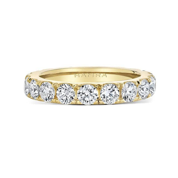 Custom made eternity band featuring 2.50 carats total weight in round brilliant cut diamonds set in 18k yellow gold.