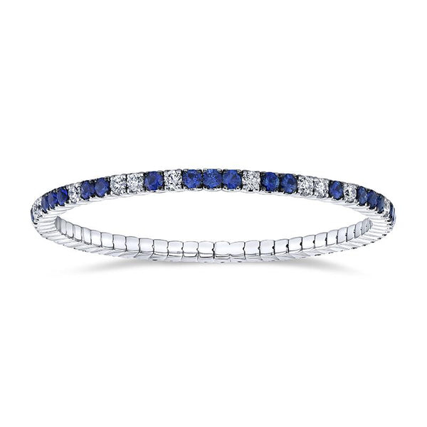 Custom made eternity bracelet featuring 4.30 carats total weight in sapphires and 2.25 carat total in round brilliant cut diamonds set in 18k white gold.