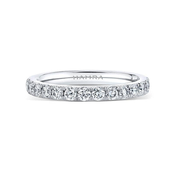 Custom made band featuring .58 carats total weight in round brilliant cut diamonds set in platinum.