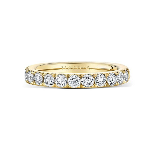 Custom made band featuring .82 carats total weight in round brilliant cut diamonds set in 18k yellow gold.