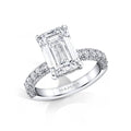 Custom made ring featuring a 4.00 carat emerald cut center diamond with 1.12 carats total weight in round brilliant cut diamonds set in platinum.
