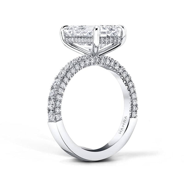 Hand crafted ring featuring a 2.01 carat emerald cut diamond center with .45 carats total weight in round brilliant cut diamonds set in platinum.