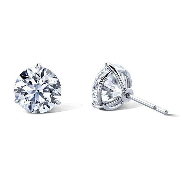 Diamond stud earrings featuring 8.00 carats total weight in round brilliant cut diamonds set in platinum.