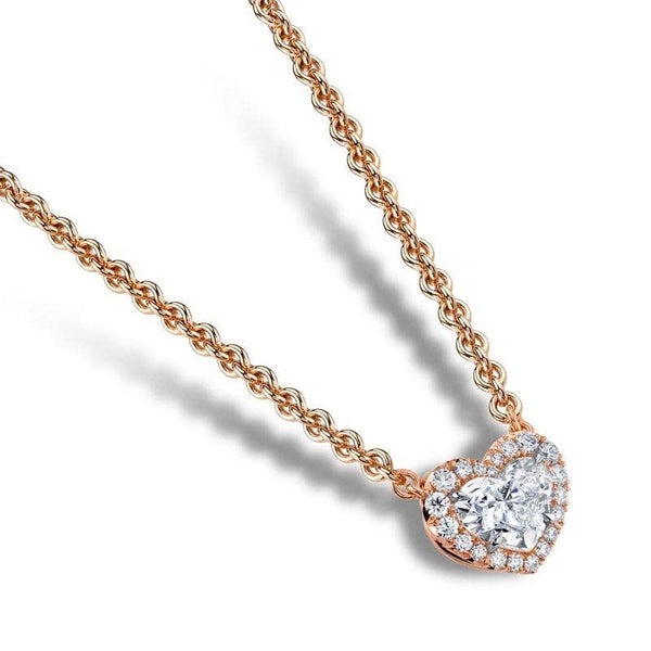 Custom made necklace featuring a 1.02 carat heart shaped diamond center with .14 carats total weight in round brilliant cut diamond accents set in 18k rose gold with a 1.8mm round cable chain with lobster clasp.
