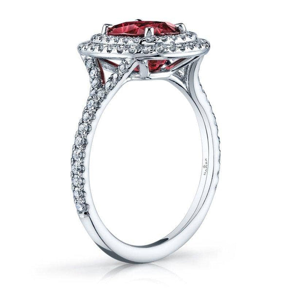 custom made ring featuring a 2.06 carat cushion cut ruby surrounded by .50 carats total weight in accent diamonds set in platinum.
