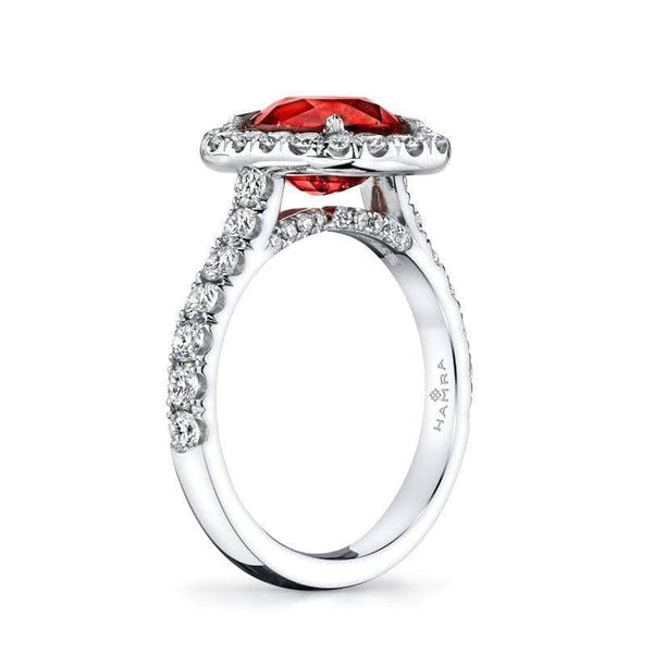 Custom made platinum ring featuring a 3.03ct oval shaped vivid red natural ruby with 1.08 carats total weight in diamond accents.