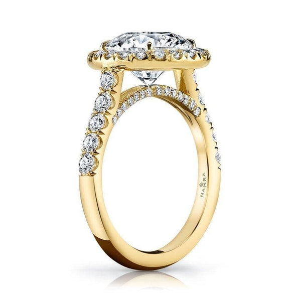 Custom hand-crafted ring featuring a 3.00 ct round brilliant cut diamond center including .91 carats total weight in accent diamonds and 18kt. yellow gold.