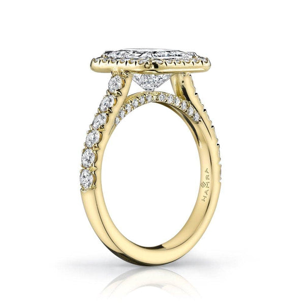Custom made 18k yellow gold ring featuring a 2 1/2 ct radiant cut diamond including .91 carats total weight in accent diamonds.