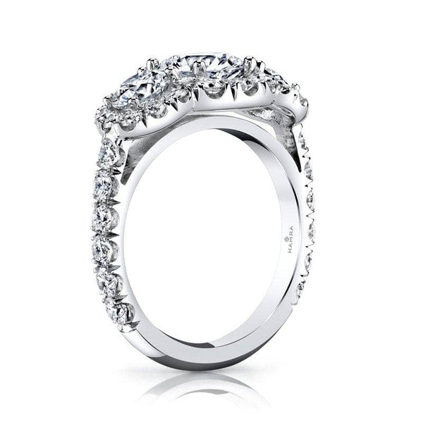 three stone ring featuring a 1.38 ct round brilliant cut center diamond including .97 carats total weight in side diamonds and an additional 1.30 carats total in accent diamonds set in Platinum.