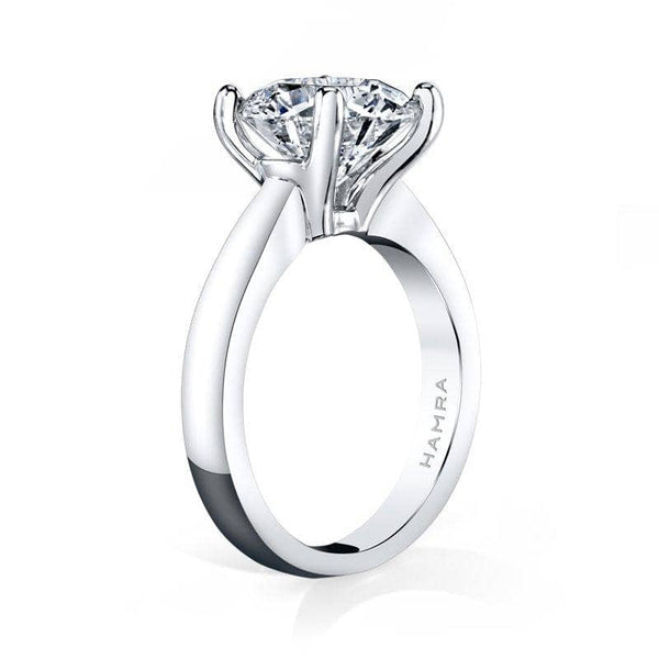 Solitaire ring featuring a 3 1/2 carat round brilliant cut diamond set in platinum.