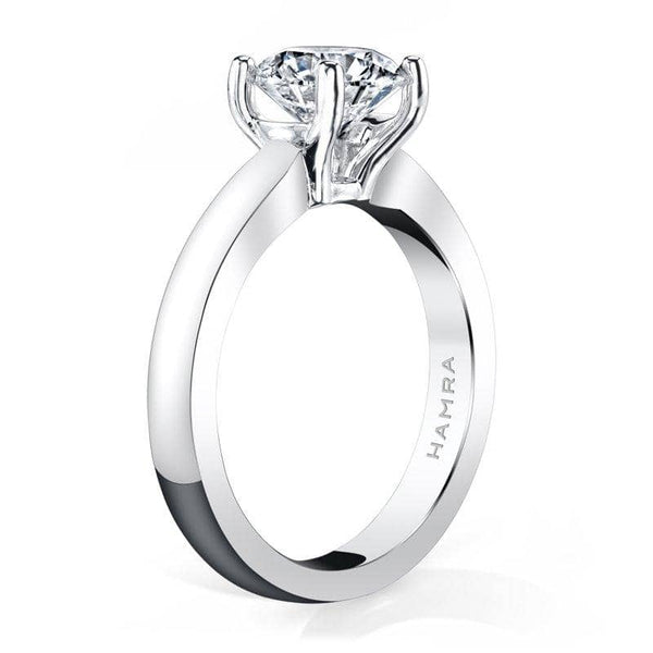 Solitaire ring featuring a 1.50 carat round brilliant cut diamond set in platinum.