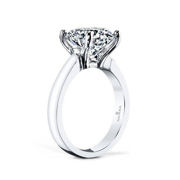 Solitaire ring featuring a 4.00 ct. round brilliant cut diamond set in platinum.