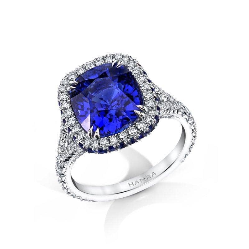 A blue sapphire is displayed on a white surface high res Neelam stone, Beautiful  ring Stock Photo | Adobe Stock