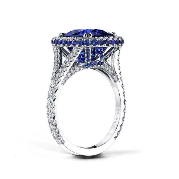 Stunning and beautiful, this amazing ring features a 7.07 ct. sapphire center stone surrounded by an additional .87 carats total weight in sapphires and .60 carats total in diamonds. Set in platinum.