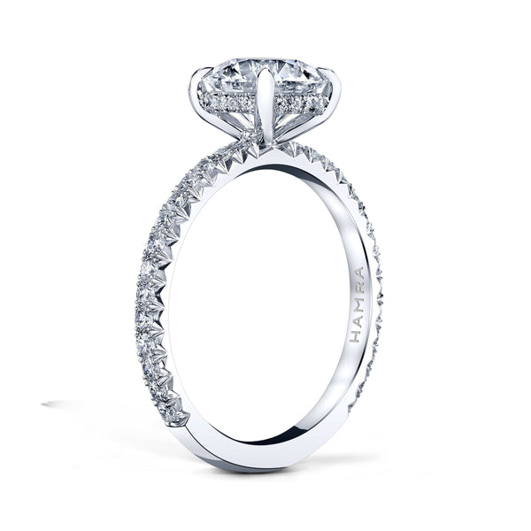 Custom made ring featuring a 1.50 carat round brilliant cut diamond center with .43 carats in round brilliant cut accent diamonds set in platinum.