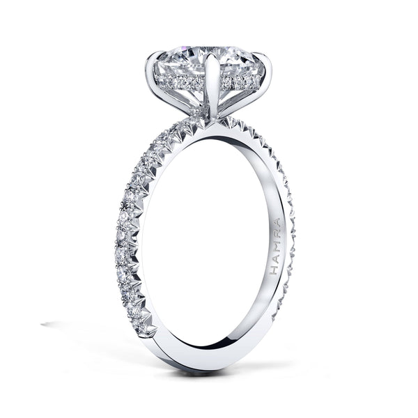 Custom made ring featuring a 2.01 carat round brilliant cut diamond center with .46 carats in round brilliant cut accent diamonds set in platinum.