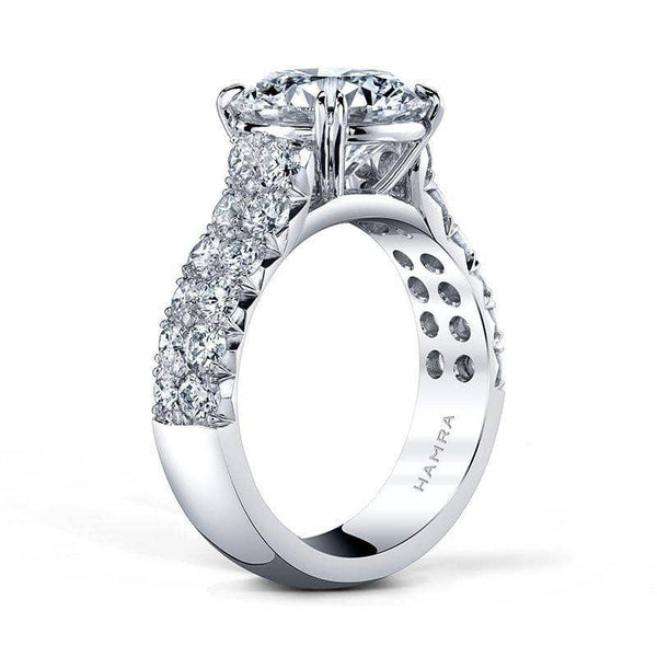 Custom made ring featuring a 4.00 carat round brilliant cut diamond center with 1.60 carats total weight in round accent diamonds set in platinum.