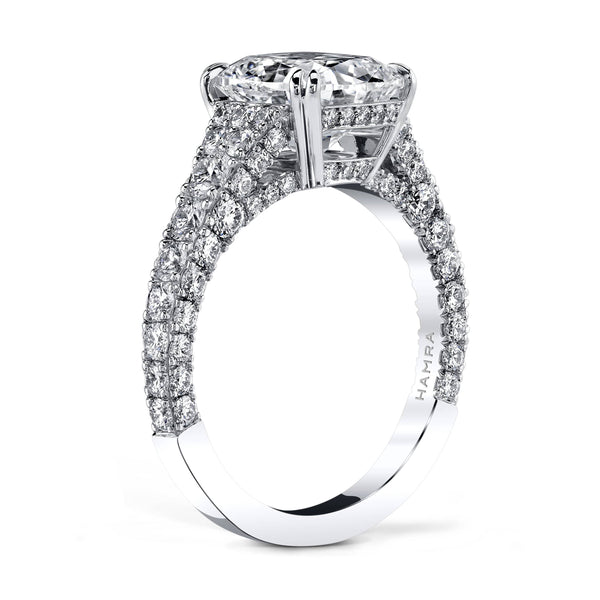 Hand crafted diamond ring featuring a 3.02 carat cushion cut diamond center surrounded by 1.49 carats total weight in round accent diamonds set in platinum.
