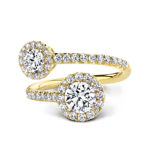 Diamond bypass ring featuring a .76 carat and a .40 carat Forevermark round brilliant cut center diamonds with .72 carats total weight in round accent diamonds set in 18k yellow gold.