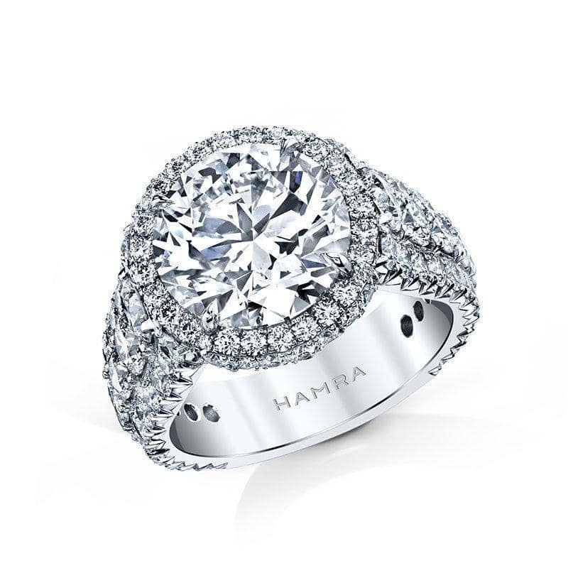 Custom made ring featuring a 5.00 carat round brilliant cut diamond center with 2.63 carats total weight in round accent diamonds set in platinum.