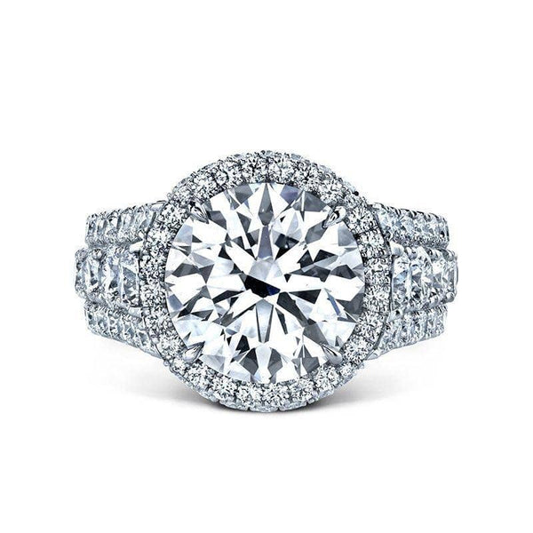 Custom made ring featuring a 5.00 carat round brilliant cut diamond center with 2.63 carats total weight in round accent diamonds set in platinum.
