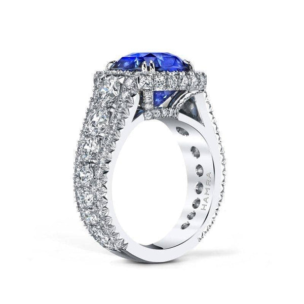 Custom made ring featuring a 6.26 carat cushion cut sapphire with 3.49 carats total weight in diamonds set in platinum.