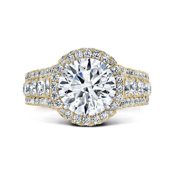 Custom made ring featuring a 3.00 carat round brilliant cut Forevermark center diamond with 2.34 carats total weight in round accent diamonds set in 18k yellow gold.